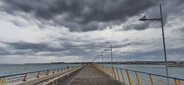 Bridge over sea against sky