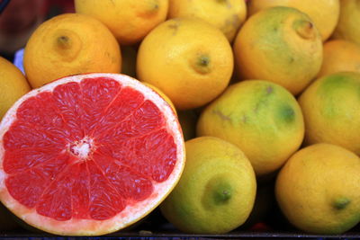 Close-up of grapefruit by lemon on table