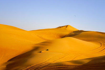 Scenic view of desert against clear sky