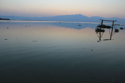 Scenic view of sea against sky at sunset