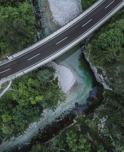 High angle view of road over river amidst trees