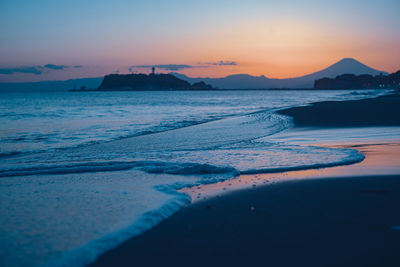 Scenic view of sea against sky during sunset