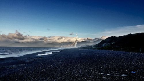 Scenic view of sea against blue sky