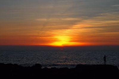 Scenic view of sea at sunset