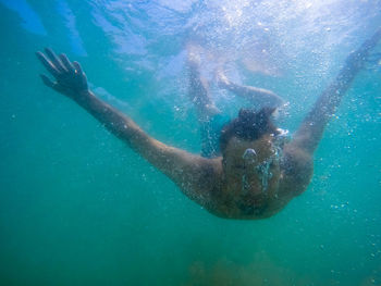 Woman swimming in sea
