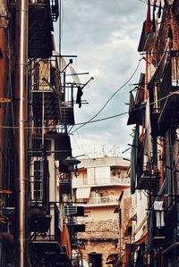 Low angle view of buildings against sky in city