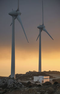 Spain, andalusia, tarifa, two wind wheels at twilight