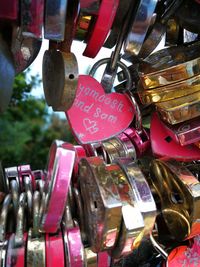 Close-up of padlocks hanging on metal