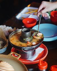 Close-up of hand preparing food