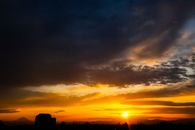 Scenic view of dramatic sky during sunset