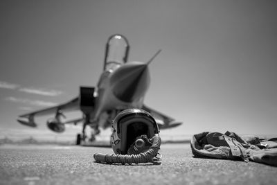 Low angle view of airplane on table against sky