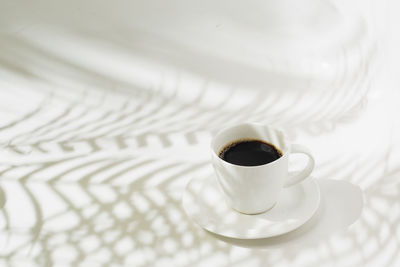 High angle view of coffee cup on table