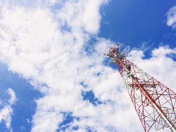 Low angle view of communications tower against blue sky