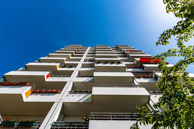 Low angle view of building against clear blue sky