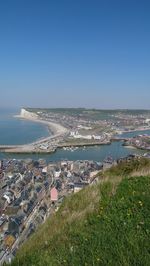 High angle view of sea against clear blue sky