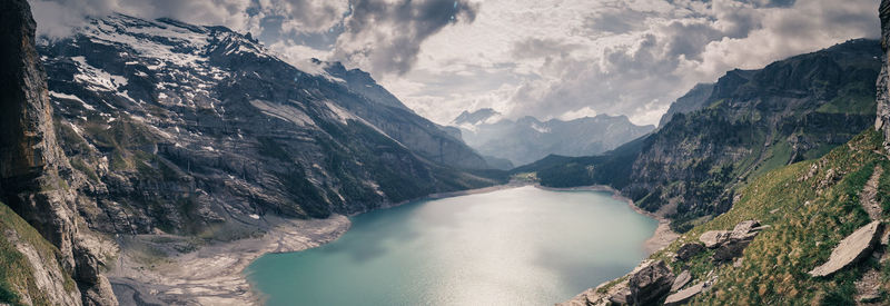 Panoramic view of river amidst mountains against sky