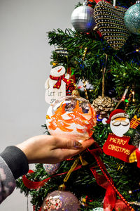 Close-up of hand holding christmas decoration
