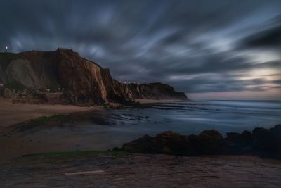 Scenic view of sea against cloudy sky