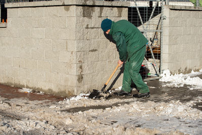 Rear view of man working at construction site