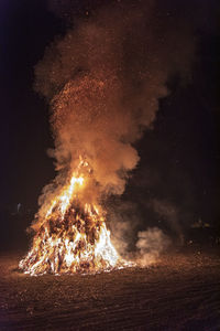 Ancient tradition of epiphany fires in friuli. pignarûl and fireworks.