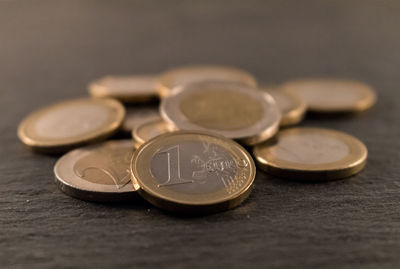 Close-up of european union coins on table