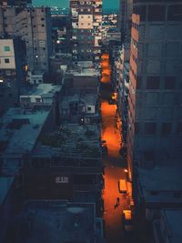 High angle view of buildings in city at night