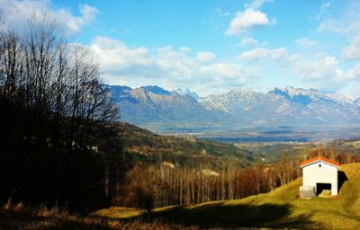 Scenic view of landscape against cloudy sky