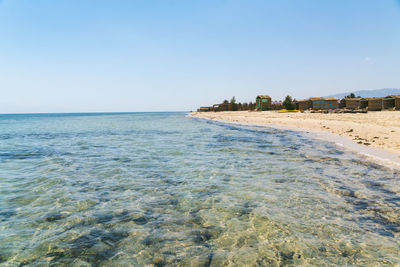 View of the red sea with clear water and bungalows