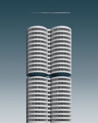Digital composite image of building against blue sky