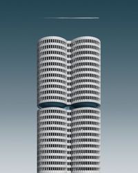 Digital composite image of building against blue sky