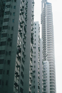 Low angle view of buildings in city against sky