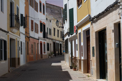 Narrow alley amidst buildings in city