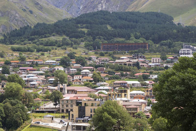  city view of stepantsminda, georgia. old houses and mountain view.