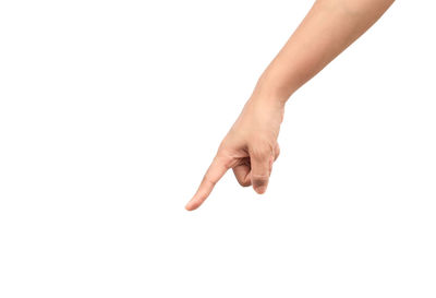 Close-up of human hand pointing against white background