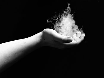 Close-up of man over black background