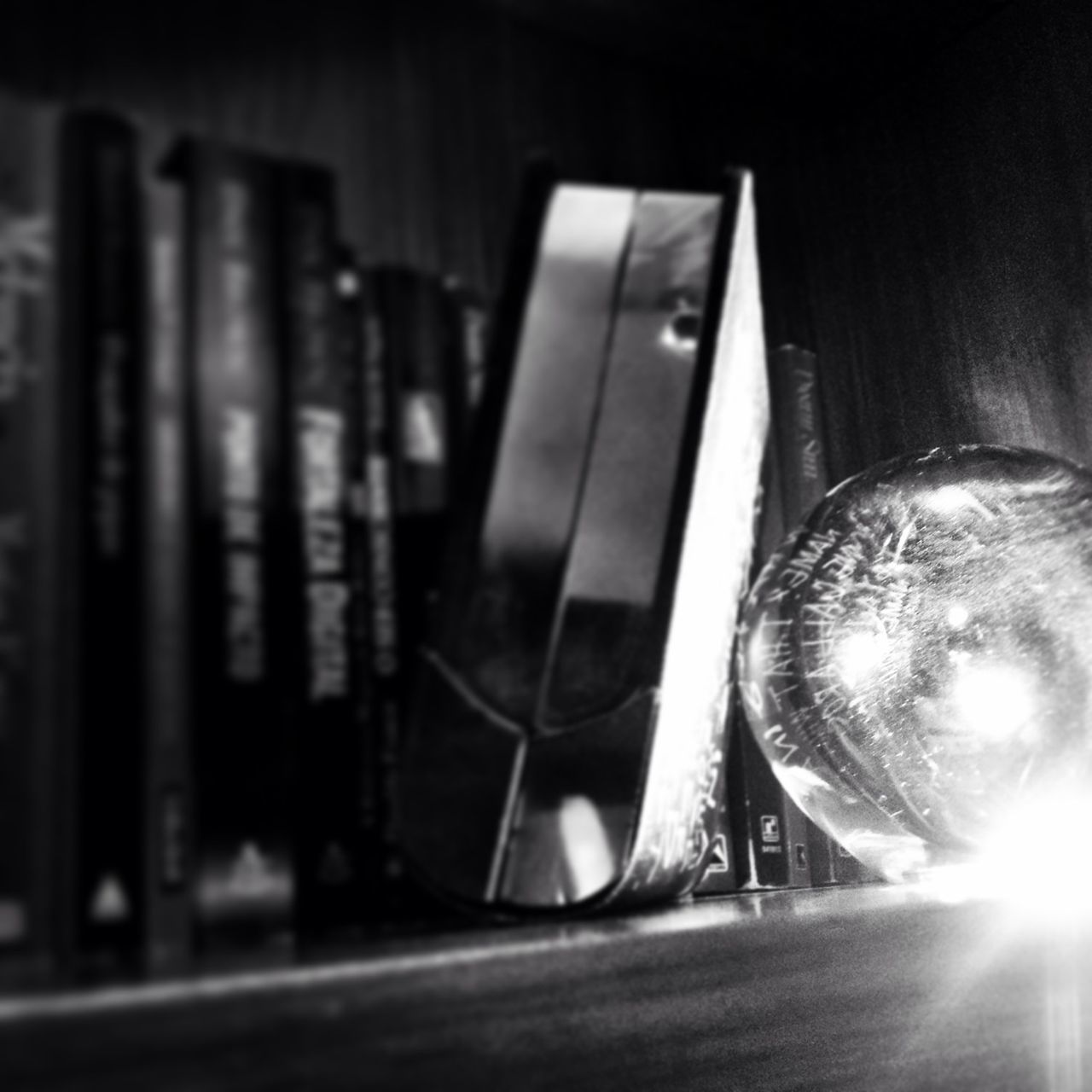 indoors, close-up, still life, table, reflection, no people, focus on foreground, glass - material, shiny, old-fashioned, retro styled, technology, sunglasses, single object, transportation, selective focus, sunlight, metal, car, absence