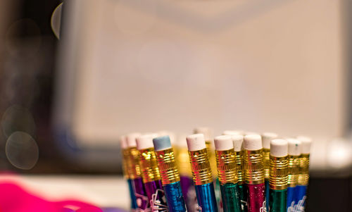 Close-up of multi colored pencils on table