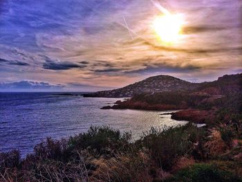 Scenic view of sea against cloudy sky