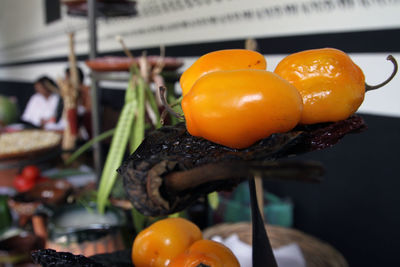 Close-up of orange fruits on table