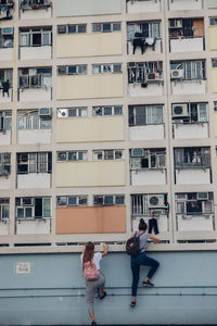 Full length of modern office building in city