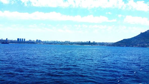 Scenic view of sea against cloudy sky