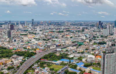 High angle view of city buildings against sky