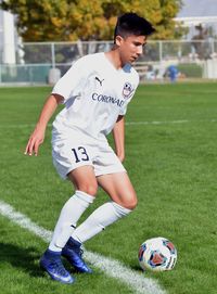 Teenage boy playing with ball