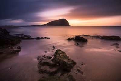 Scenic view of sea against sky at sunset