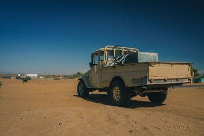 View of car on desert land