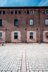 Footpath by building in city