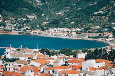 High angle view of townscape by sea