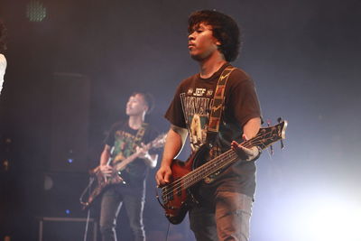 Young man playing guitar