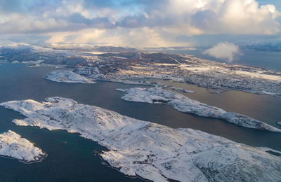 Aerial view of frozen sea against sky