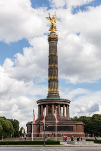 Low angle view of statue against cloudy sky